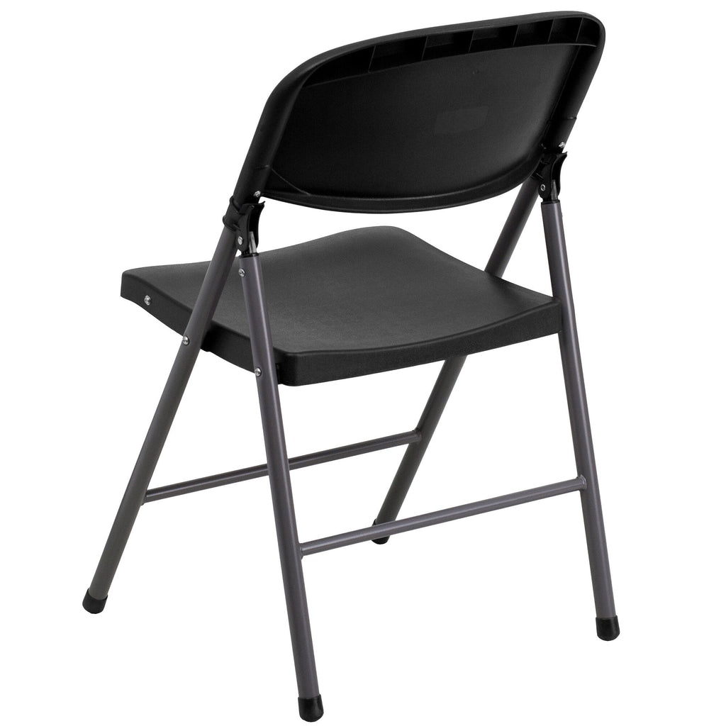 A TITAN black plastic folding chair with a black molded seat and charcoal metal frame.