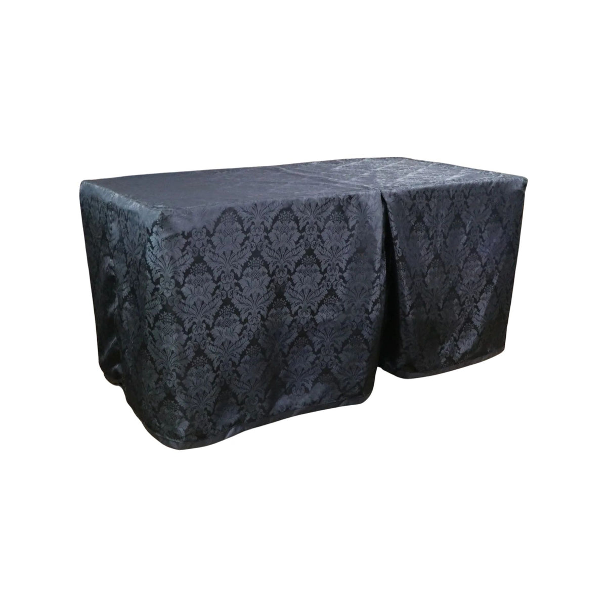 Carlisle Black cover fitted over a rectangular folding table, with a full-length skirt and overlapping front panels.