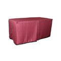 Williston Burgundy cover fitted over a rectangular folding table, with a full-length skirt and overlapping front panels.