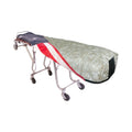 Reversible mortuary cot cover in Cresswell Gold, shown on a wheeled cot with the American flag reverse folded back at one end.